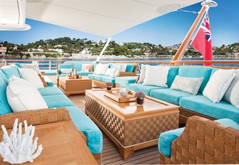 al fresco seating area with turquoise upholstery on board luxury yacht Baton Rouge 