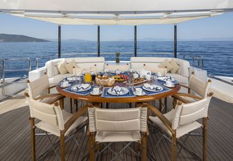 alfresco dining area on the upper deck aft of charter yacht L’EQUINOX