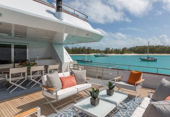 Aft deck seating area and alfresco dining on charter yacht M3