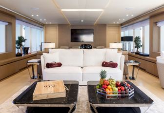 main salon with light woods and upholstery on board superyacht K