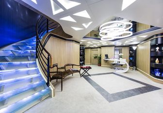 Hallway and lit-up staircase of motor yacht SALUZI