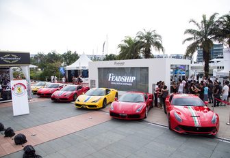 supercars line up in front of Feadship exhibition at Singapore Yacht Show