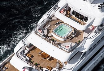 the aft deck areas including the upper deck with a Jacuzzi on board charter yacht Areti 