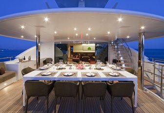 alfresco dining area on the upper deck aft of charter yacht JEMS