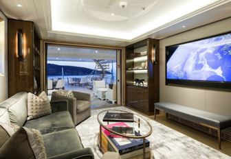 sofas and large TV screen in the skylounge of charter yacht JOY