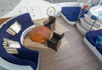 half moon-shaped seating area on the sundeck of motor yacht Sequel P