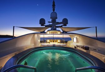 the spa pool lights up at night on the sundeck of luxury yacht JAGUAR 