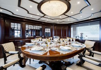 dining salon with rich, wooden dining table on board luxury yacht ELENI