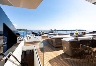 aft deck of superyacht solo, with infinity pool in background and seating area beyond