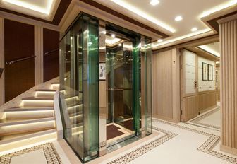 Elegant lift and stairs on Superyacht AXIOMA