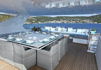 square dining table for 12 on sundeck of luxury yacht OURANOS