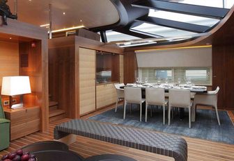formal dining under skylight in main salon aboard luxury yacht ‘State of Grace’ 