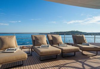 sun loungers lined up on the deck of charter yacht Big Sky 