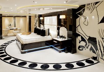 Art deco style master suite with phoenix motif on the wall on board charter yacht Phoenix 2