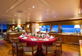 main salon dining table set for a formal occassion aboard luxury yacht ‘Seven Sins’ 