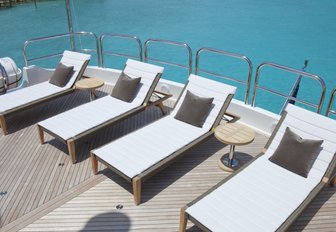 sun loungers line up on the sundeck aft aboard motor yacht COCKTAILS 
