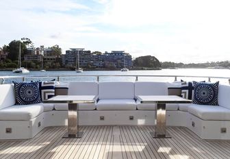 U-shaped sofa on the main deck aft of luxury yacht Infinity Pacific