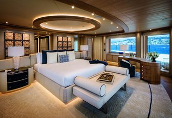 large bed in master suite with panoramic views on board superyacht Cloud 9