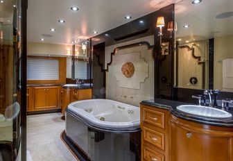 Ensuite of master cabin on charter yacht M3, with marble furnishings and Venetian-style touches