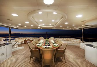 alfresco dining table on the upper deck aft of luxury yacht JAGUAR 