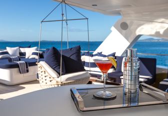 swing chair and lounging areas on the sundeck of motor yacht Take 5
