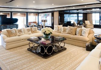 pop art-inspired main salon with sumptuous seating and piano aboard charter yacht ‘Alfa Nero’ 
