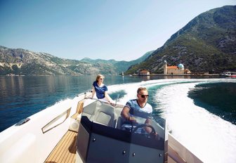 charter guests take out the tender on the clear, calm waters of Montenegro 