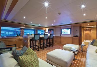 bar and L-shaped sofa in laid-back skylounge on board luxury yacht HANA 
