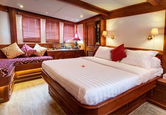 master suite with Balinese carvings on board luxury yacht Mutiara Laut 