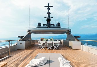 sunpads and alfresco dining area on the sundeck of luxury yacht GIRAUD