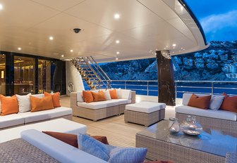 seating forms an alfresco lounge on the aft deck of charter yacht ‘Here Comes The Sun’ 