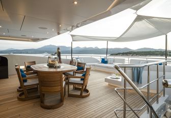 alfresco dining set-up and soft seating area on motor yacht irisha 