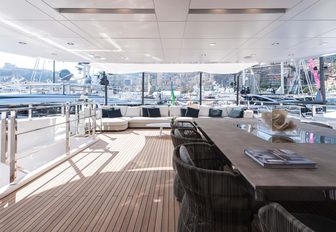 alfresco dining area on the upper deck aft of charter yacht ENTOURAGE 
