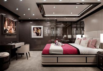 luxury yacht spectre's guest cabin, furnished in dark materials with plenty of spotlights