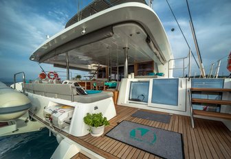 wide aft area with built-in sofa on board charter yacht Ocean View 