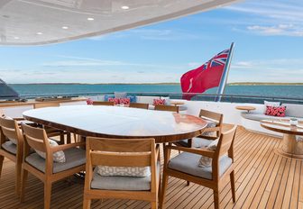 new alfresco dining and seating area on the bridge deck aft of luxury yacht Broadwater