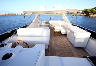 Flydeck of motor yacht JURIK, with dining and sunpads