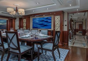 formal dining area in the main salon of superyacht AVALON 