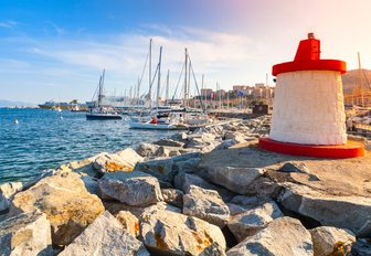 yachts lined up in Ajaccio harbour at sunset in Corsica