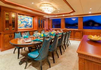 formal dining area in main salon of charter yacht MIM