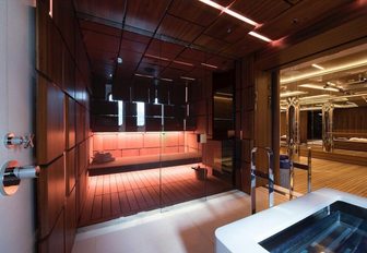 The dark wood and lighting which comprises the sauna of superyacht CLOUDBREAK