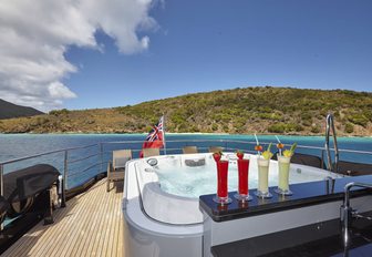 cocktails lines up on the Jacuzzi of motor yacht Grey Matters