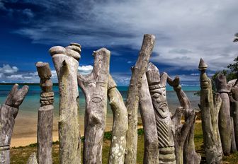 carved totem memorial to European Missionaries on Isle Of Pines, New Caledonia