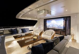 cinema setup at night on the main deck aft of luxury yacht LAURENTIA 