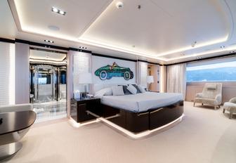 large bed in the light and airy master suite aboard luxury yacht O’PTASIA 