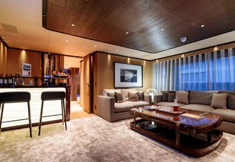 warm and modern styling with rosewood in the skylounge of charter yacht VERTIGE 