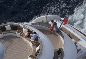 charter guests relax on the aft decks of luxury yacht ASYA 
