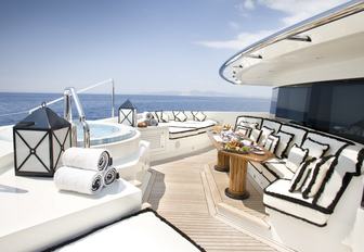a Jacuzzi and seating forward of the master suite on board motor yacht ‘Alfa Nero’ 