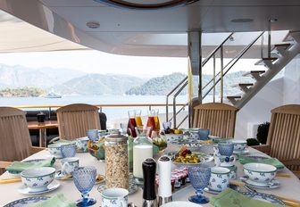 alfresco dining on upper deck aft of luxury yacht ‘Seven Sins’ 