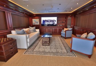 sofa, armchairs and TV in the skylounge aboard motor yacht CLARITY 